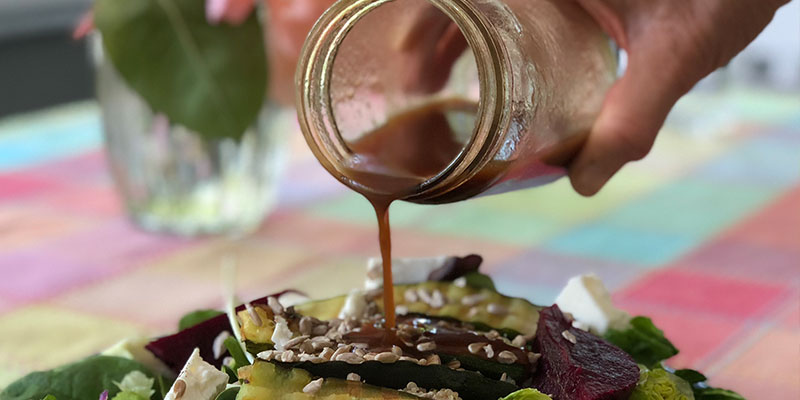 Balsamic vinaigrette over a fresh salad